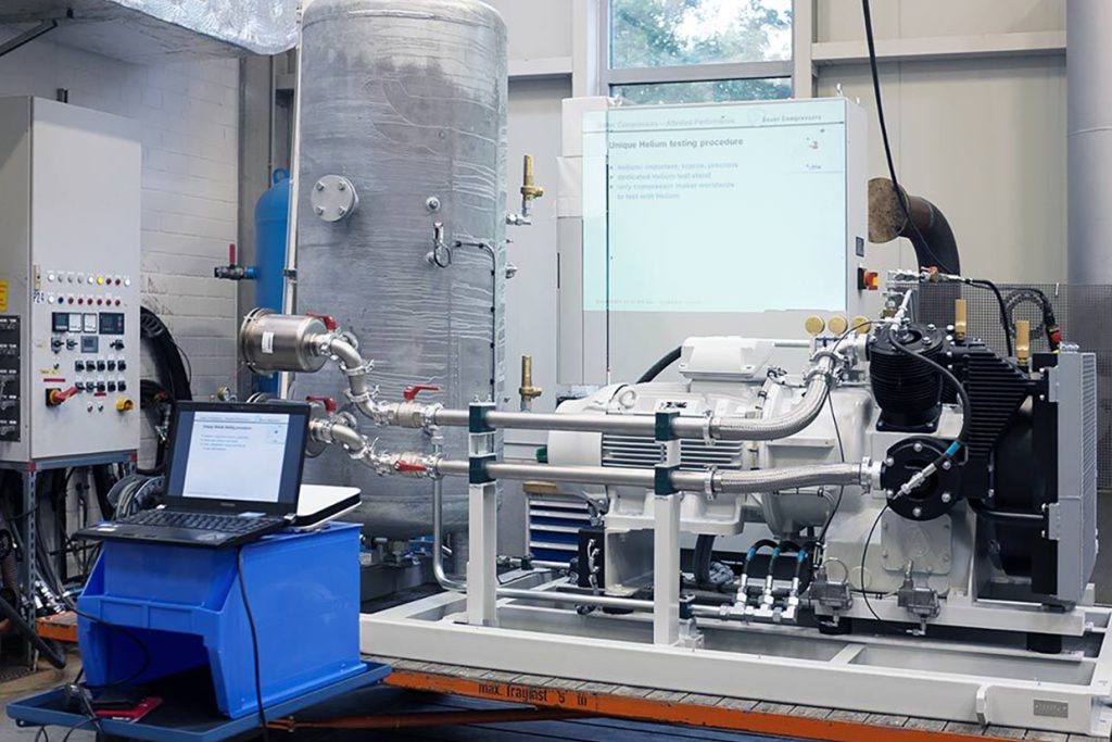 Sauer helium test bench used for dynamic pressure and leakage testing, with instrumentation and laptop setup monitoring compressor performance under real helium operating conditions.